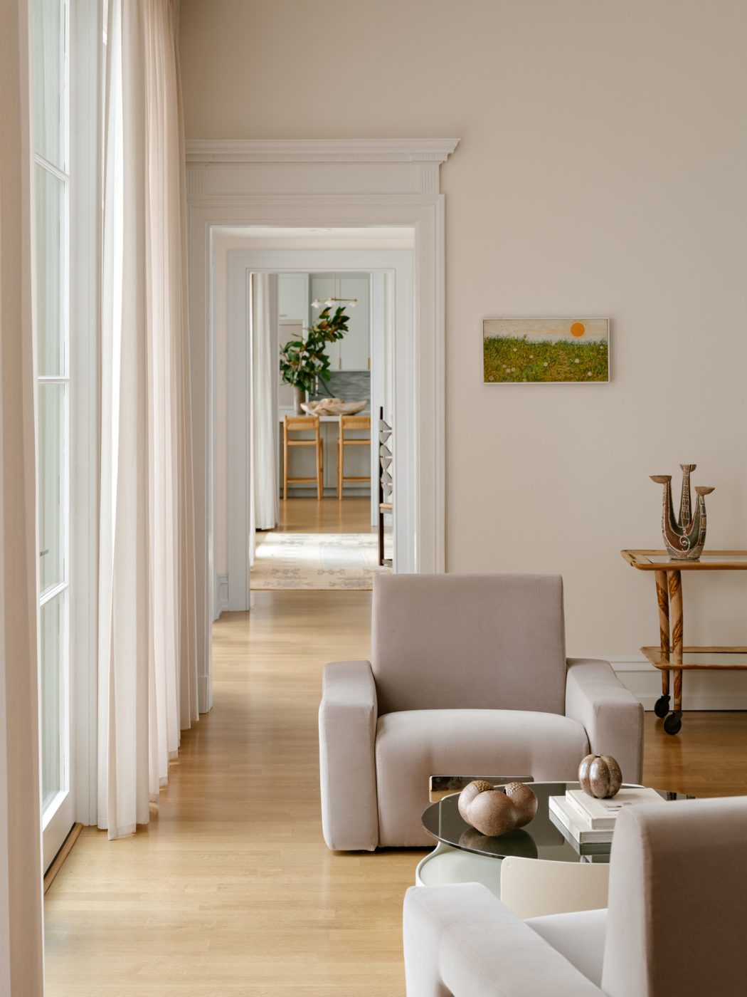 Seating vignette with 1970s Mario Sabot lounge chairs flanking an Erik van Buijtenen for Nebu low table in the living room of a Long Island home with interiors by studio Evan Edward designers Michael Edward Moirano and Josh Evan Goldfarb