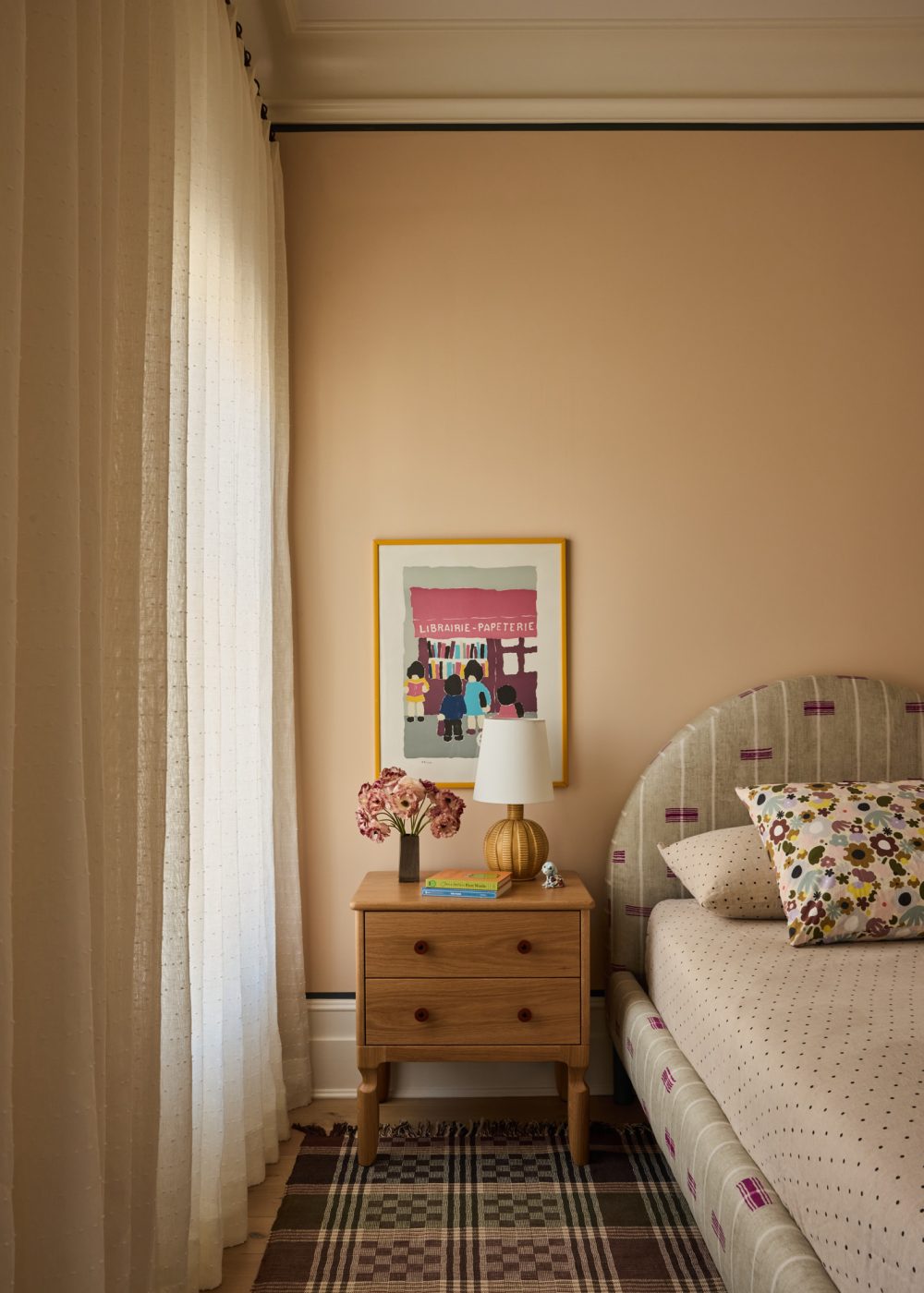 Child's bedroom with twin bed and arched headboard and simple wooden nightstand in Prospect Heights Brooklyn brownstone renovated by the interior design firm Jesse Parris-Lamb