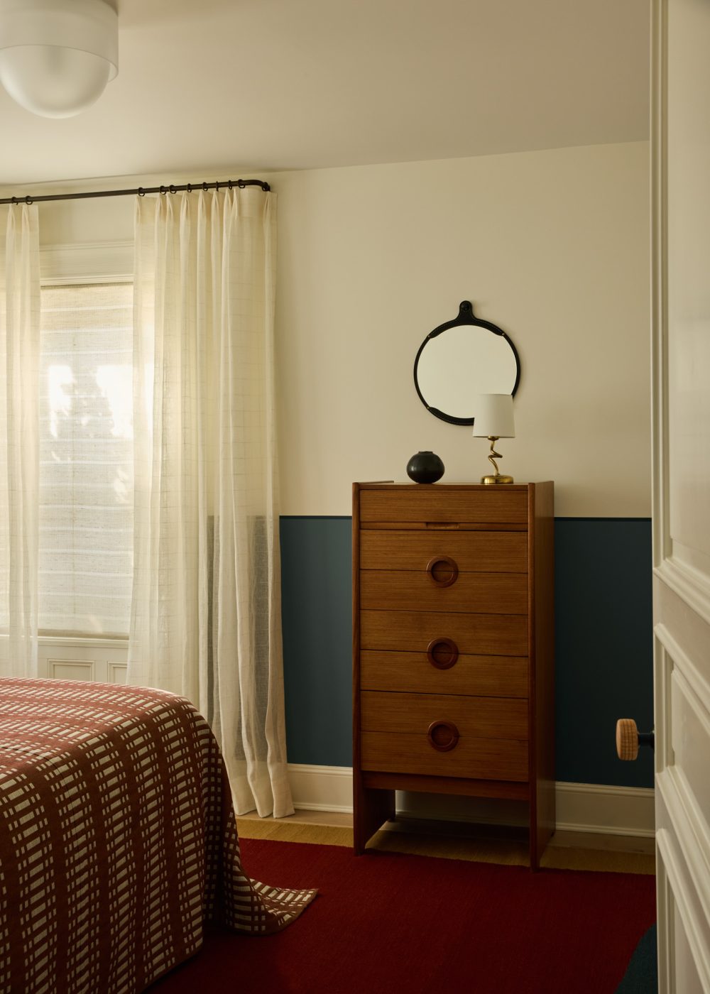 Guest bedroom with tall chest of drawers in Prospect Heights Brooklyn brownstone renovated by the interior design firm Jesse Parris-Lamb