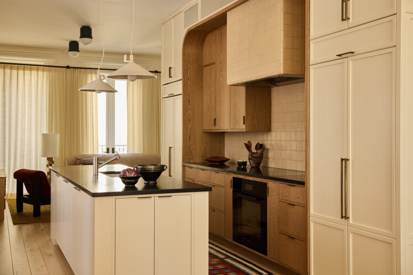 New central kitchen with two tone white and wood cabinets in Prospect Heights Brooklyn brownstone renovated by the interior design firm Jesse Parris-Lamb