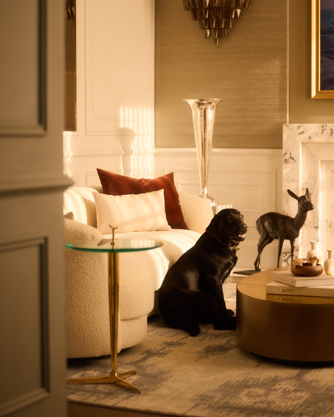 Pale-hued living room with contemporary sofa, Giusseppe Ostuni side table and Meridani brass coffee table in a 19th-century Georgian-style manor house in Irish Countryside designed by Dublin-based Róisín Lafferty