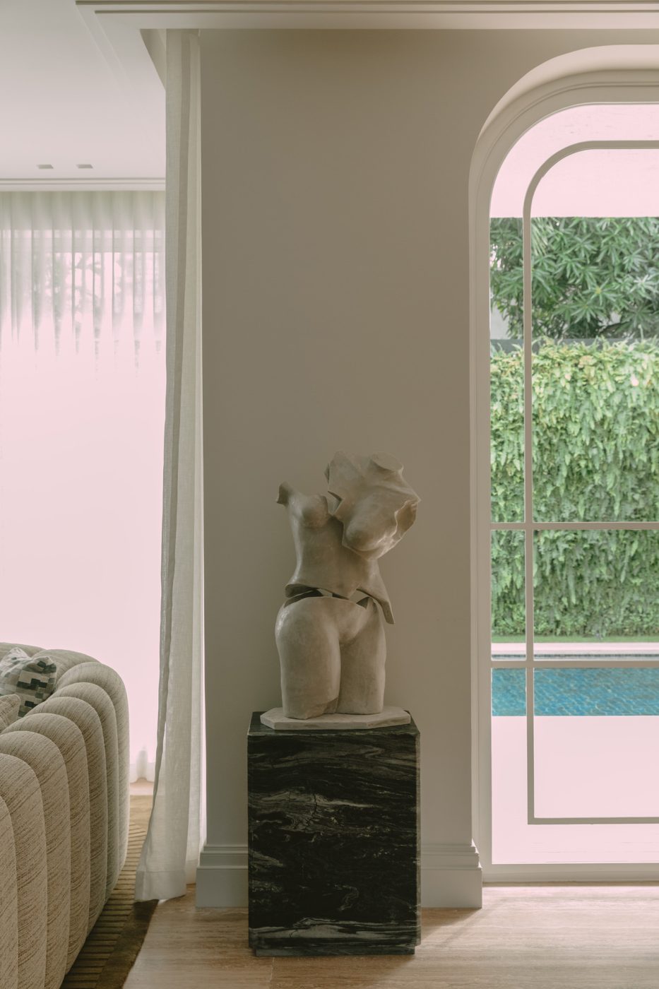 A Fragmentia sculpture of a women's torso tops a plinth in a home Marcela Cure designed in Barranquilla, Colombia