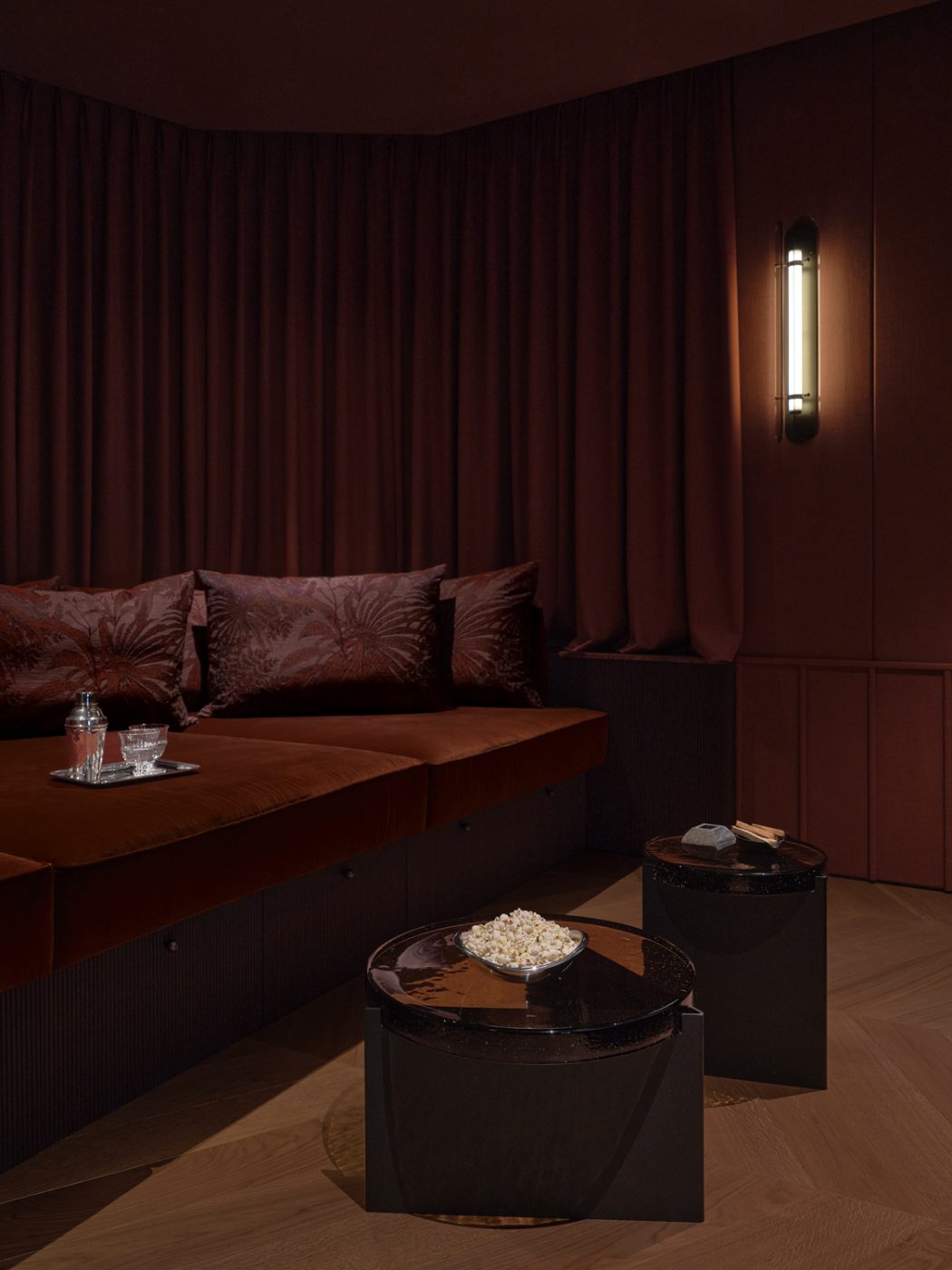 darkly hued cinema room in a Milan penthouse whose interiors are by Edo Mapelli Mozzi, founder of the design and development firm Banda.