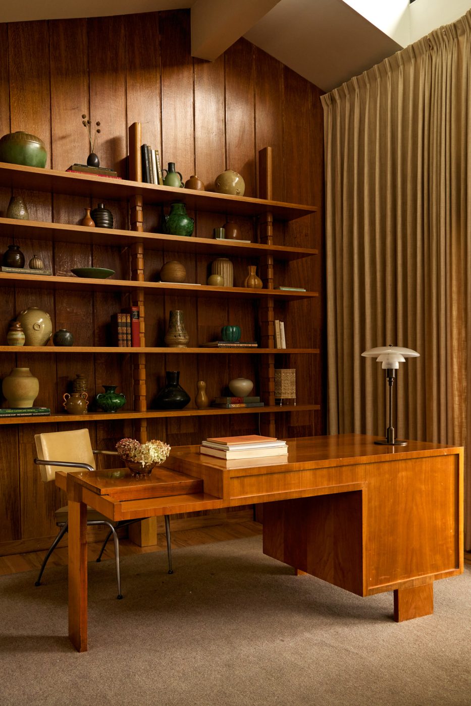 Family room of 1970s-era home in the Emeryville neighborhood of High Point North Carolina owned by husband and wife Michael Radziewicz and Jennifer Ponce, of the mid-century-modern furniture gallery PRB Collection