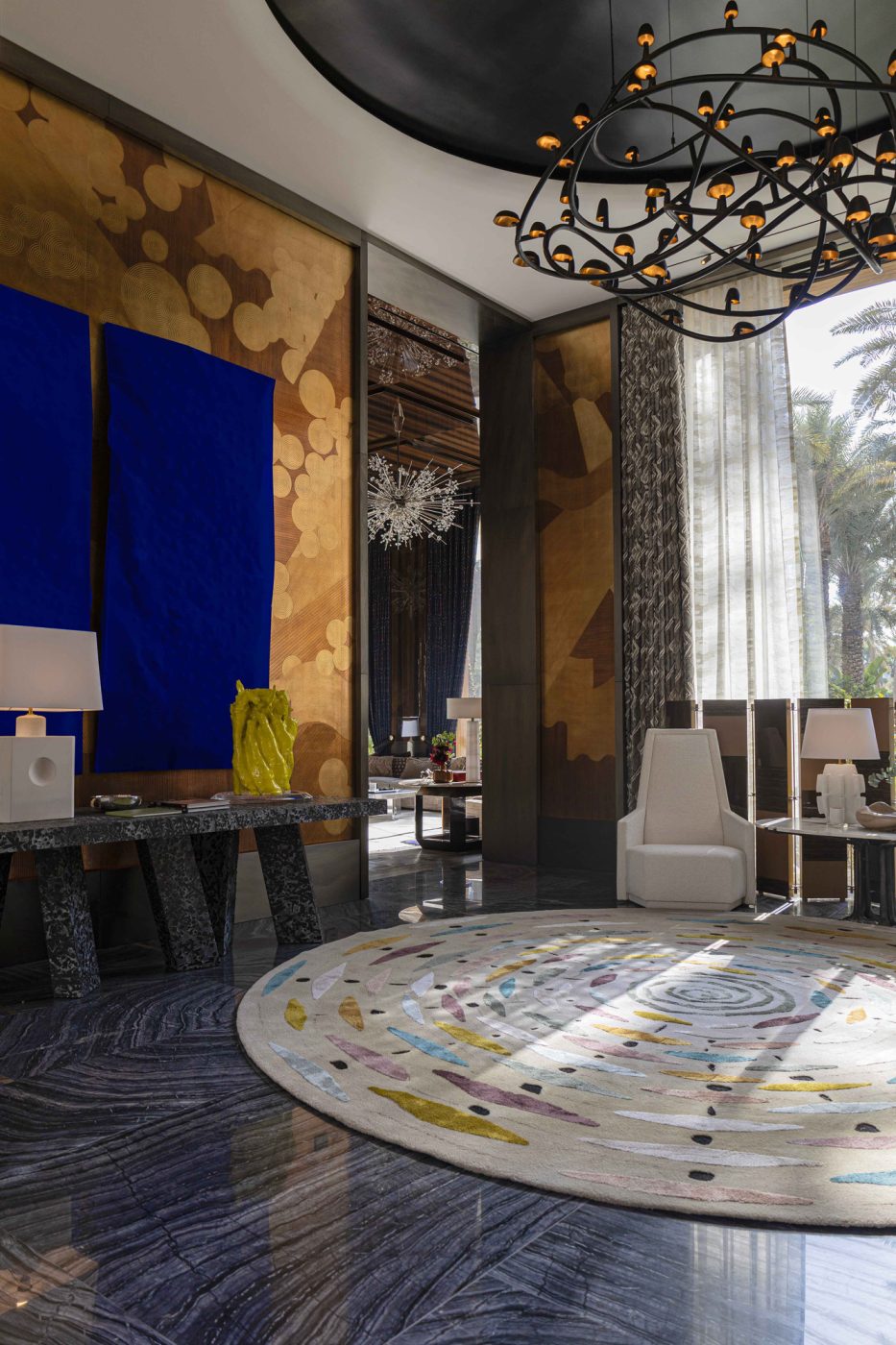 Entrance hall with Hervé Van der Straeten console table and a Sandra Baía diptych artwork in entertaining pavilion of a large compound in Saudi Arabia by Jacques Bec and Artur Miranda's architecture and design studio Oitoemponto
