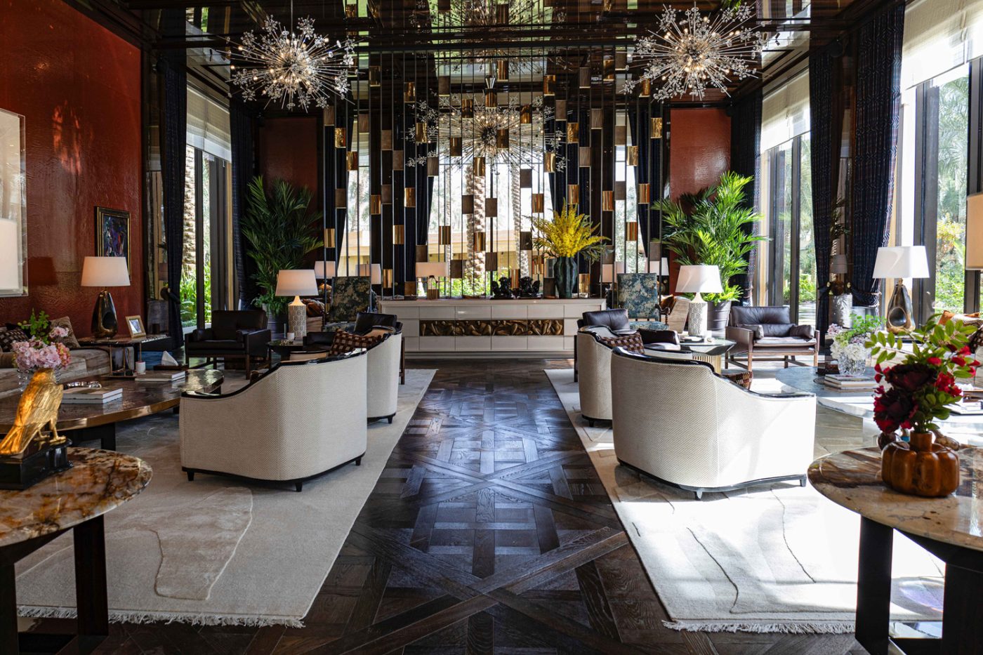 Grand salon in the entertaining pavilion of a large compound in Saudi Arabia by Jacques Bec and Artur Miranda's architecture and design studio Oitoemponto mirrored wall ,J. & L. Lobmeyr Hans Harald Rath chandeleirs