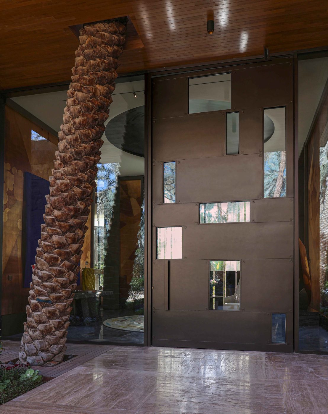 Monumental front door of entertaining pavilion of a large compound in Saudi Arabia by Jacques Bec and Artur Miranda's architecture and design studio Oitoemponto