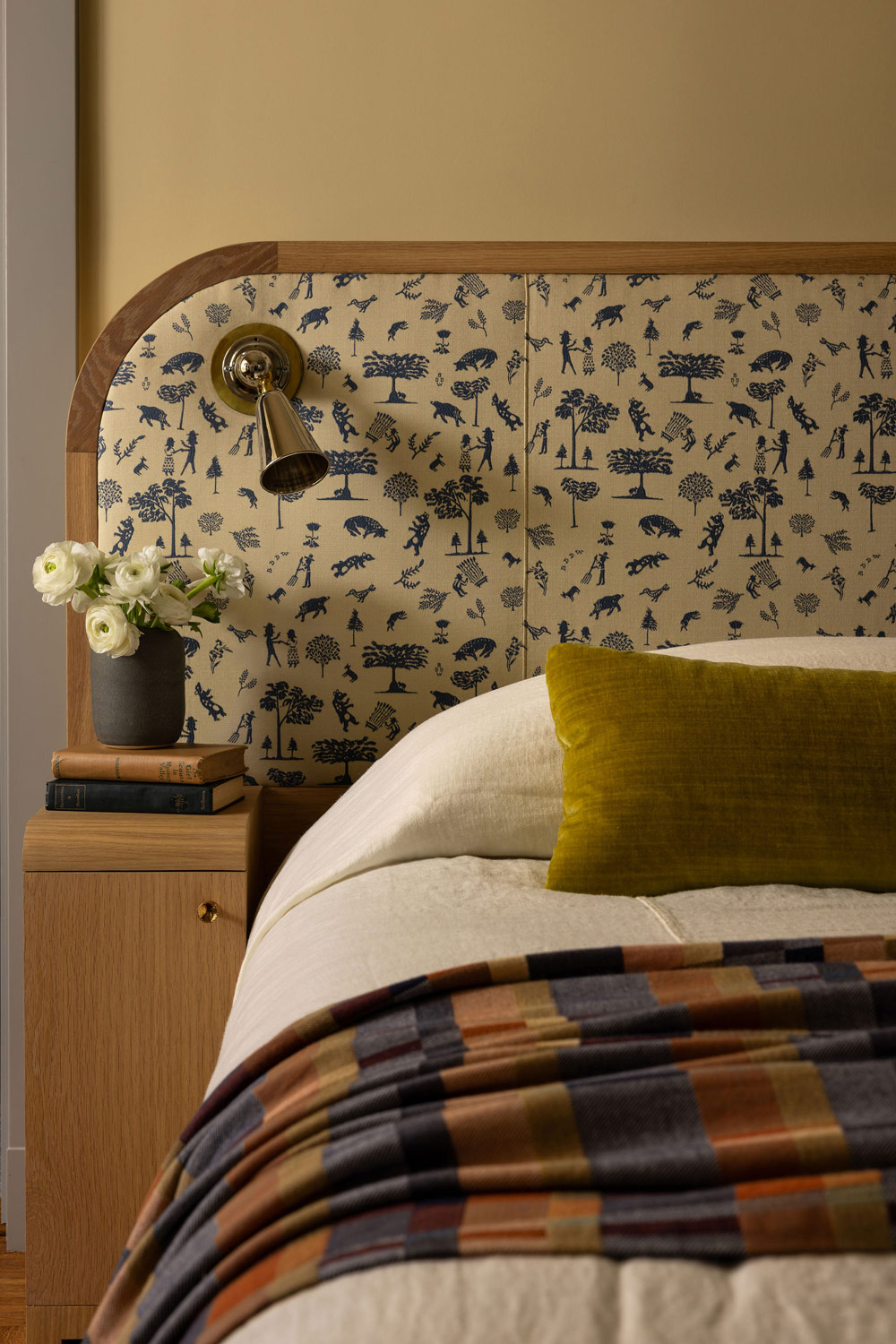 Upholstered headboard in Primary bedroom of Craftsman-style house in San Francisco's Presidio designed by Katie Troutman
