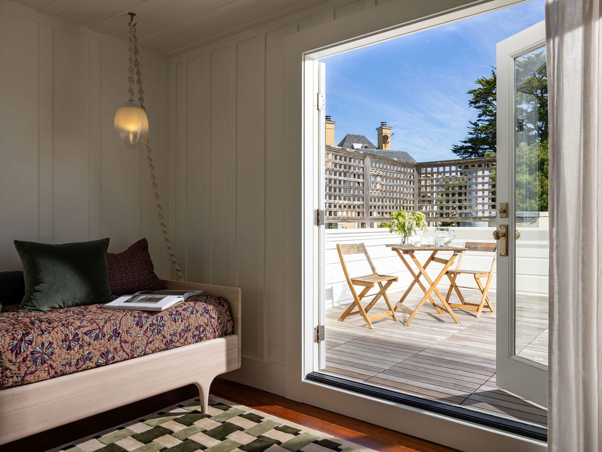 Penthouse room with view to roof terrace of Craftsman-style house in San Francisco's Presidio designed by Katie Troutman