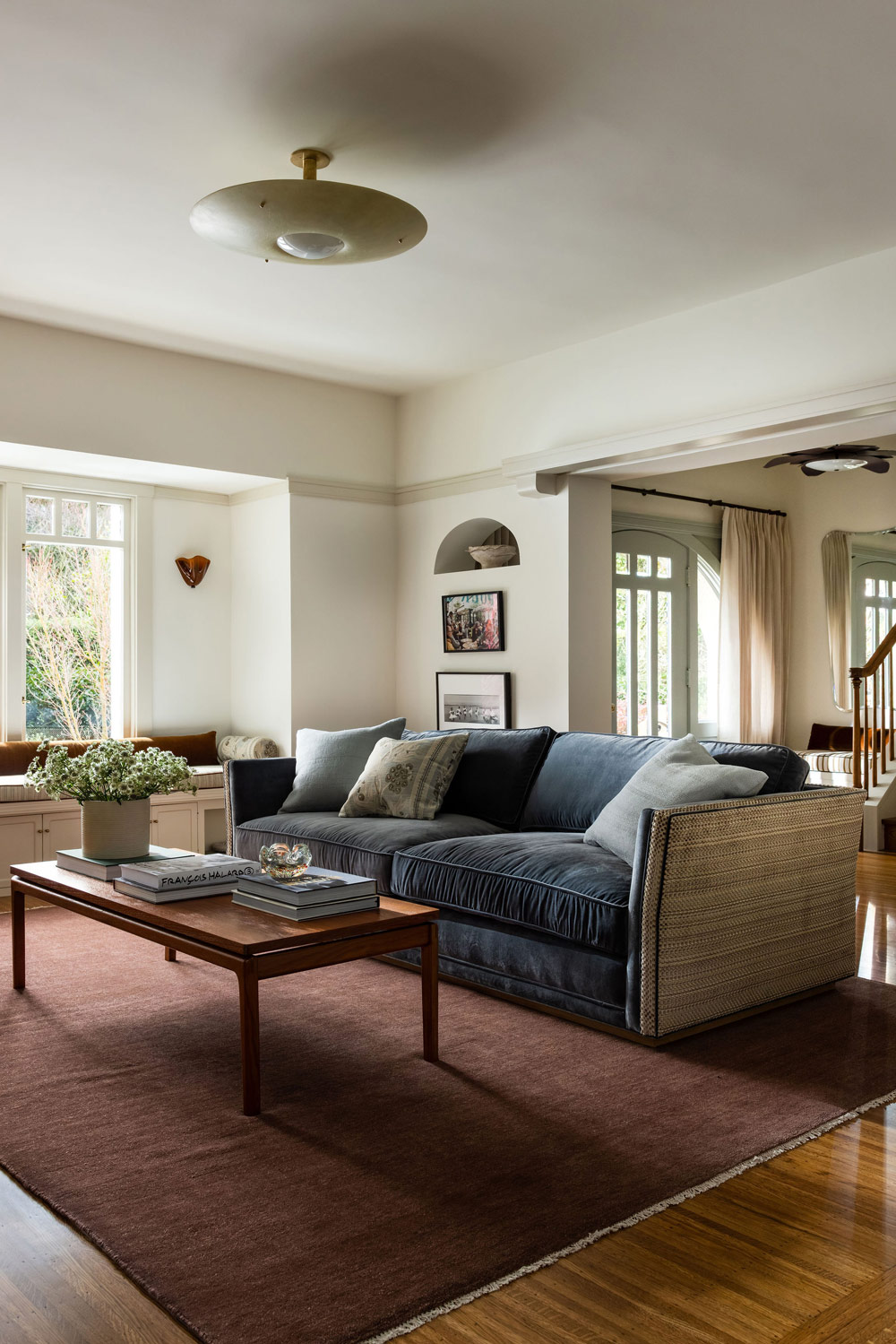 Living room of Craftsman-style house in San Francisco's Presidio designed by Katie Troutman and featuring a custom sofa upholstered in performance velvet and a Lee Jofa weave