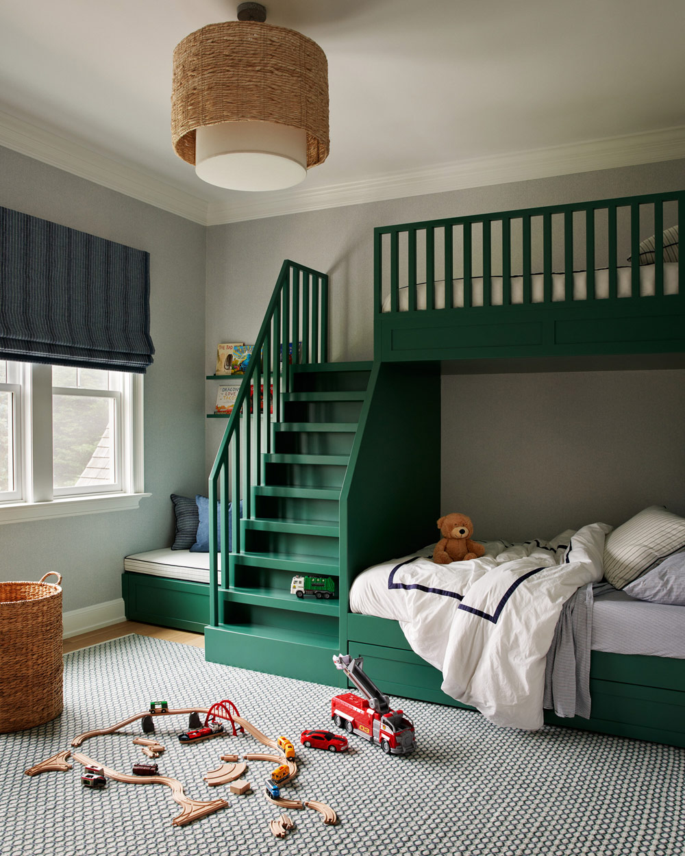 Bunk room with green-painted beds in Southampton house with interiors by Janine Carendi MacMurray or Area Interior Design