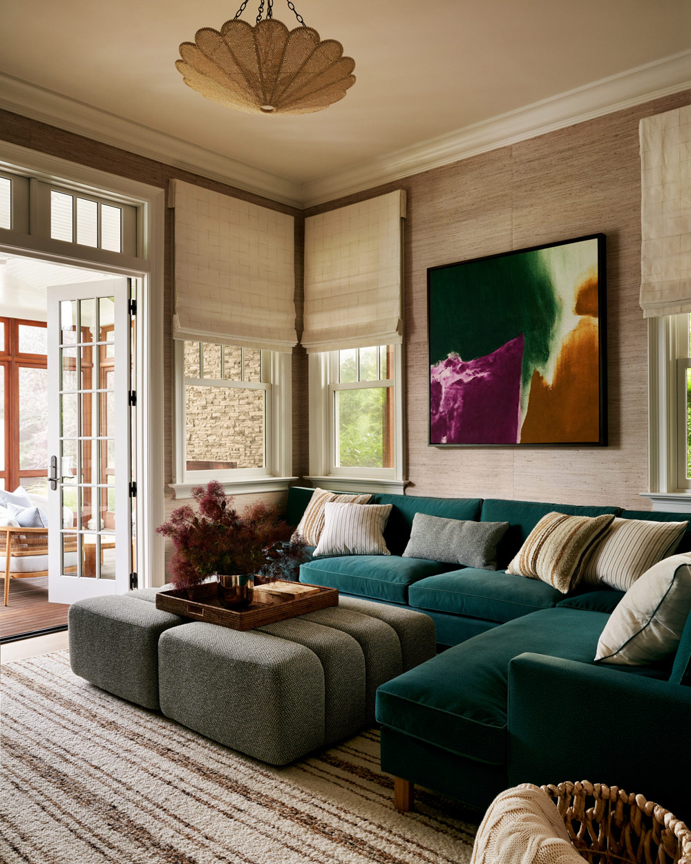 custom upholstery and vintage artwork in sitting room of Southampton house with interiors by Janine Carendi MacMurray or Area Interior Design