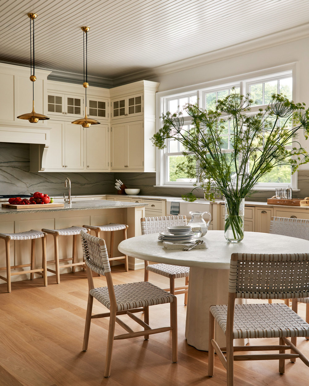 White cabinet kitchen in Southampton house with interiors by Janine Carendi MacMurray or Area Interior Design