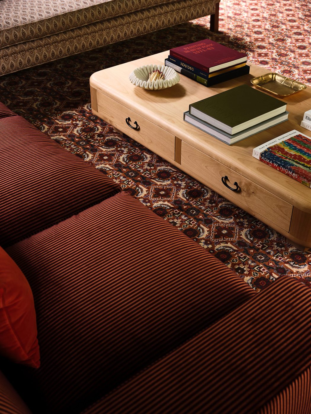 Custom patterned carpet and Loro Piano-upholstered sofa in the great room of a New Hampshire house with interiors by designer Zoe Feldman