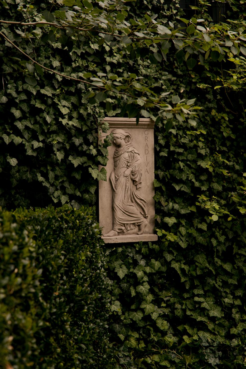 On offer by the gallery Galerie Green is a mid-20th-century French cast-stone cornucopia finials atop an antique cast-stone bench
