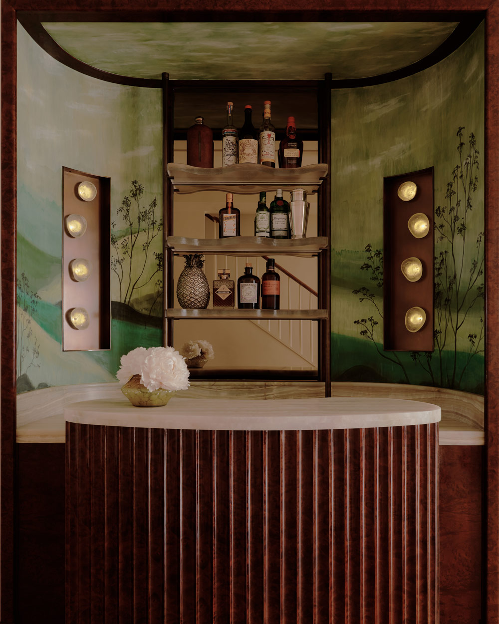 retractable bar that moves on a track into a niche in the entry hall of a duplex apartment on New York's Park Avenue designer by Bryan O'Sullivan