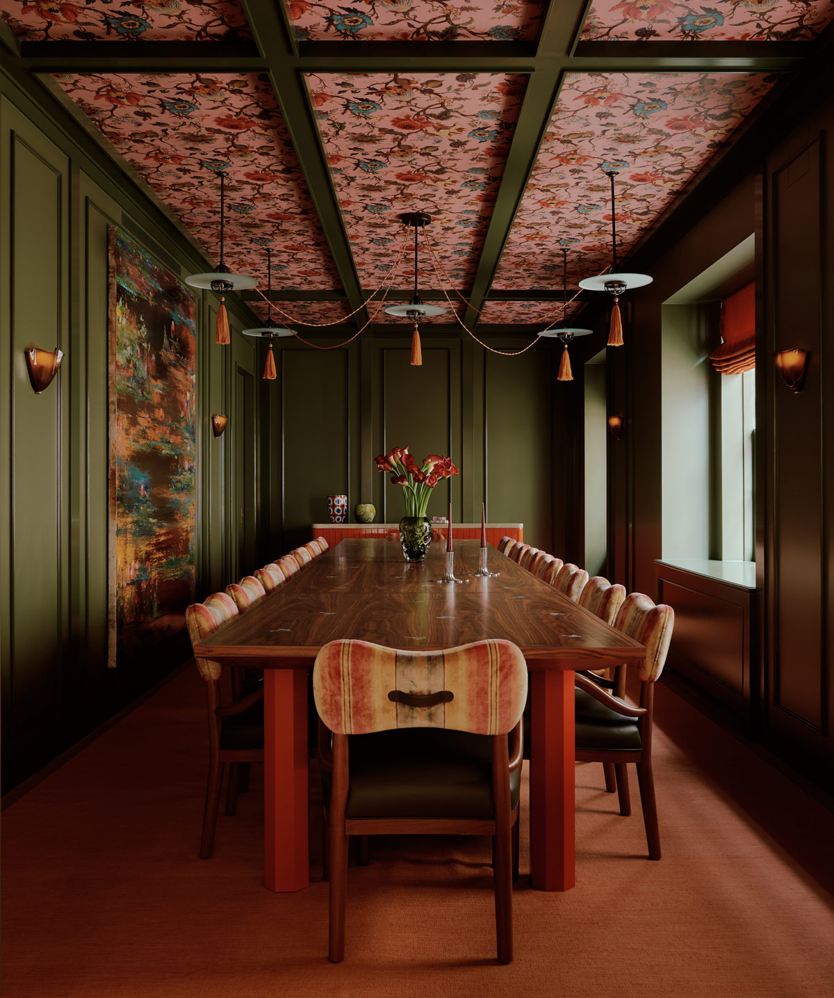 Green-walled dining room with Cardinal Hat pendant lights by Edwin Lutyens and ceiling covered in a House of Hackney floral-pattern paper plus custom table with red legs in a duplex apartment on New York's Park Avenue designer by Bryan O'Sullivan