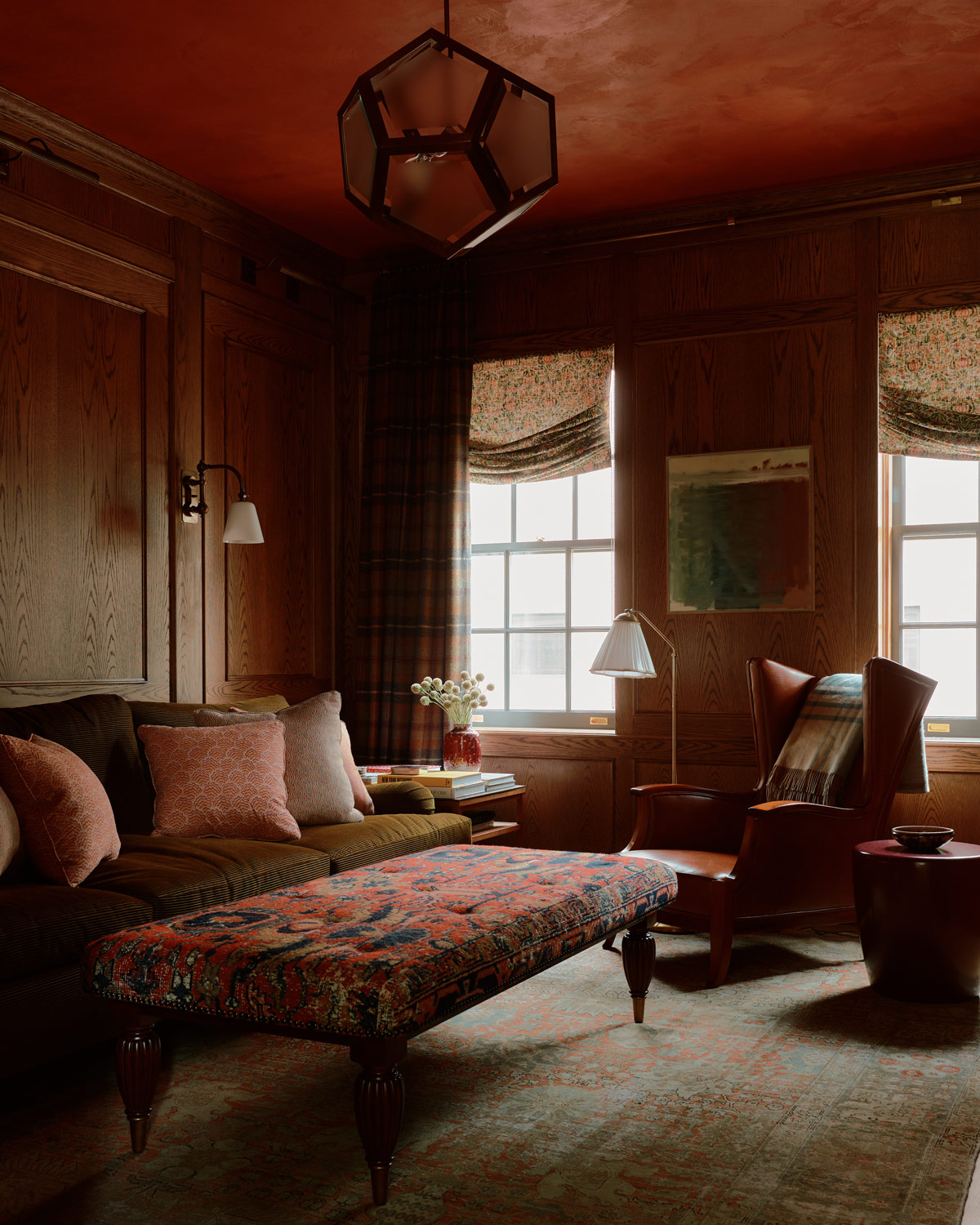 Ralph Lauren-inspired den/study/library with plaids and antique prints and leather in a duplex apartment on New York's Park Avenue designer by Bryan O'Sullivan