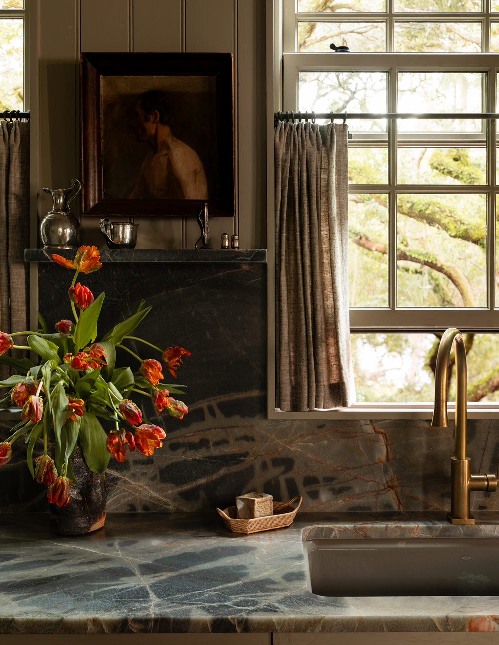 Kitchen of a former agrarian building on South Carolina's Edisto Island reimagined as a vacation home by interior designer Sean Anderson and architect Will Wingfield