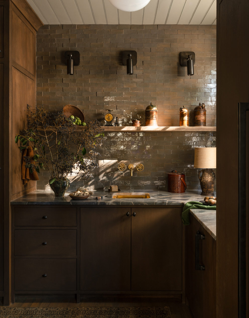 Kitchen of a former agrarian building on South Carolina's Edisto Island reimagined as a vacation home by interior designer Sean Anderson and architect Will Wingfield